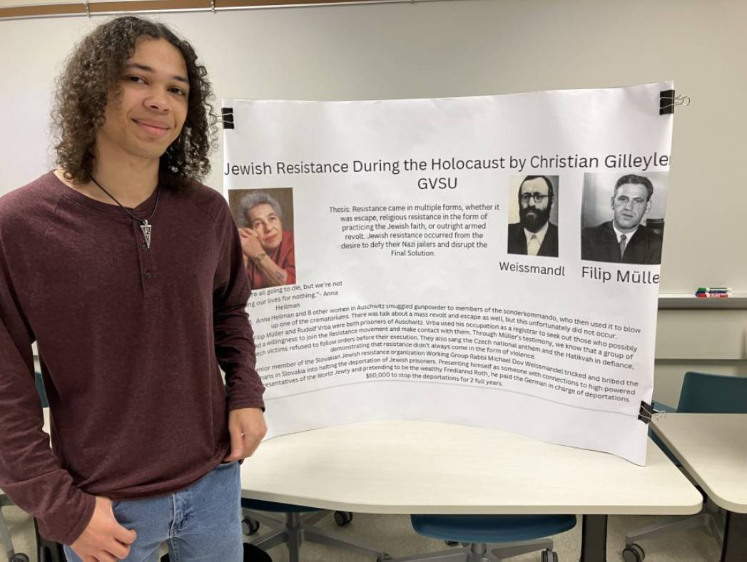 Christian Gilleylen Standing by his Presentation